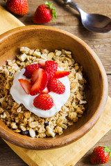Homemade granola with yogurt and strawberries