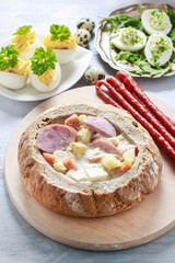 The sour rye soup inside loaf of bread