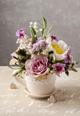 Romantic bouquet of roses and peonies