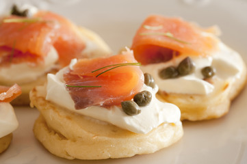 Close up on fish blini appetizers