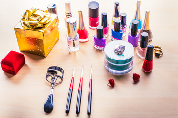 Cosmetics makeup on black background. Top view mock up. Selective focus square.