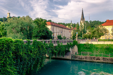Slovenia Ljubljana Tromostovje Ljublianica river Church with bridge