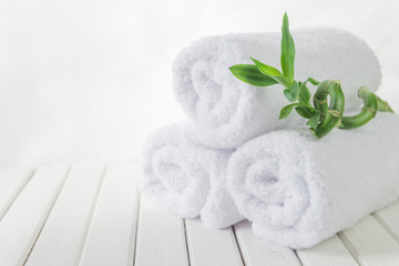 Obraz na płótnie Canvas White bath towels and Lucky bamboo