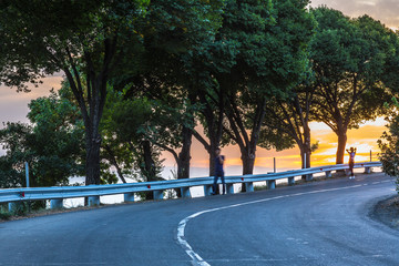 road on a hill at sunset