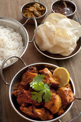Spicy tandoori chicken served with poppadoms