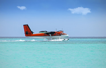 seaplane soft landing on turquoise ocean