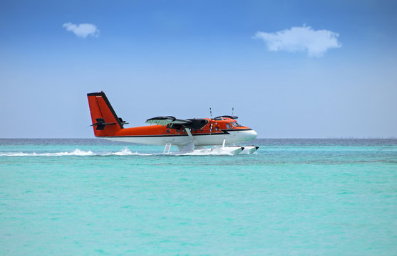 seaplane soft landing on turquoise ocean