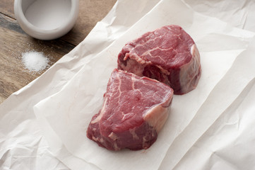 Two medallions of raw fillet steak