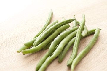 green beans on wooden table