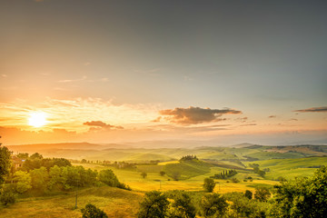 Fototapeta na wymiar Beautiful tuscan landscape view in Val dOrcia region near Pienza town on the morning in Italy. Wide angle photo with copy space