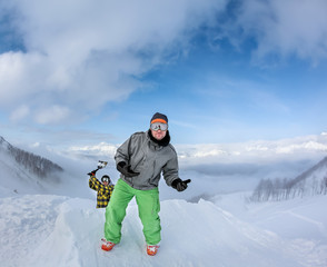 Fototapeta na wymiar Two joyful snowboarder in the mountains