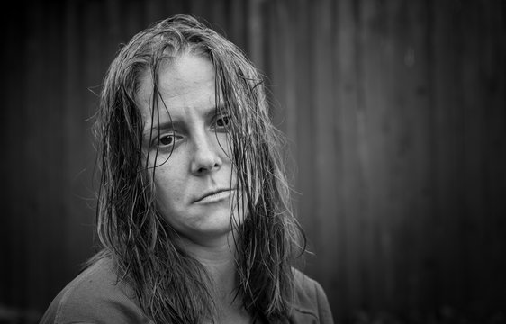 Portrait of a woman with wet hair. Serious facial expression.
