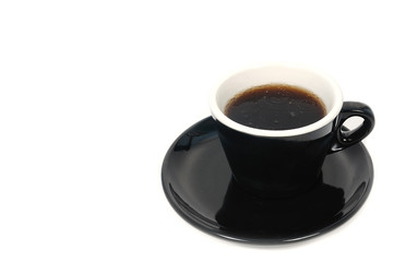 Black cup of coffee on white background.