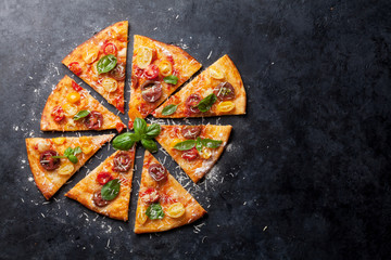 Pizza with tomatoes, mozzarella and basil