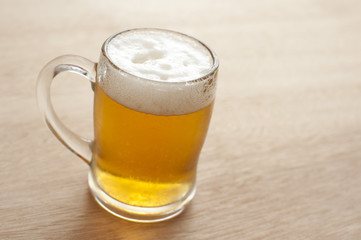 Tankard of cold frothy beer