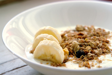 Delicious and healthy granola or muesli, banana, nuts  yogurt