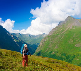 Fototapeta premium A woman in mountain day summer. Green forest