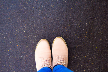 boots on the pavement, top view