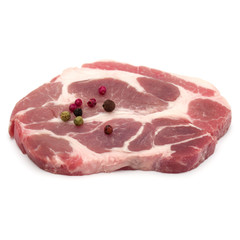 Raw pork neck chop meat with peppercorn spices garnish isolated
