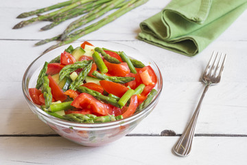 Vegetable salad with asparagus and tomatoes