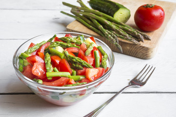 Vegetable salad with asparagus and tomatoes