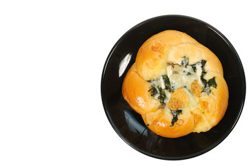 Bread baked spinach on black plate with copy space
