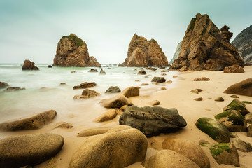 Fototapeta na wymiar Isolated beach Ursa on Atlantic coast near the Cape Roca, Sintra, Portugal