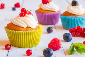 Colorful cupcakes with fresh berries