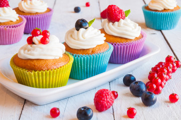 Colorful cupcakes with fresh berries