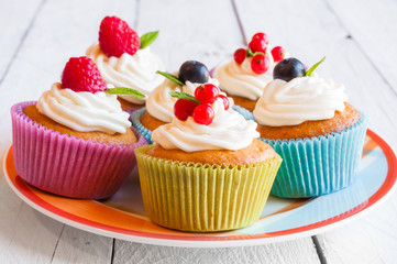 Colorful cupcakes with fresh berries