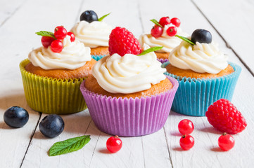 Colorful cupcakes with fresh berries