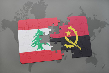 puzzle with the national flag of lebanon and angola on a world map background.