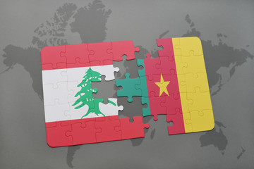 puzzle with the national flag of lebanon and cameroon on a world map background.
