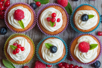 Colorful cupcakes with fresh berries