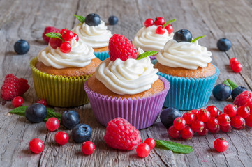 Colorful cupcakes with fresh berries