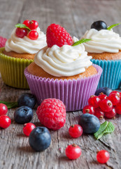 Colorful cupcakes with fresh berries