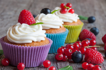 Colorful cupcakes with fresh berries