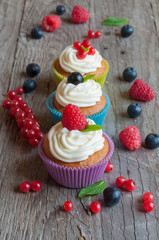 Colorful cupcakes with fresh berries