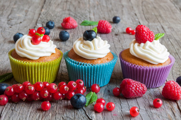 Colorful cupcakes with fresh berries