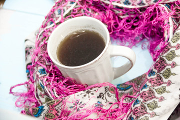Cosy soft winter background, knitted sweater Cup hot coffee old vintage wooden board. Christmas holidays at home. place for text, Top view, flat lay with copy space for slogan or text message