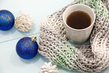 Obraz na płótnie Canvas Cosy soft winter background, knitted sweater Cup hot coffee old vintage wooden board. Christmas holidays at home. place for text, Top view, flat lay with copy space for slogan or text message