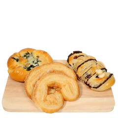 Many kinds of baked bread, croissant, butterfly pies and spinach