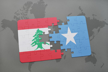 puzzle with the national flag of lebanon and somalia on a world map background.