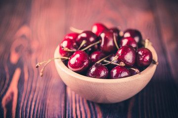 Cherry in a wooden bowl