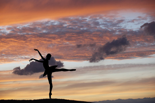 Ballet dancer posing during the sunset