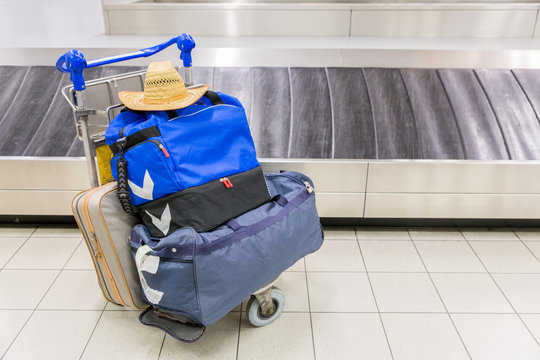 Luggage near baggage band at airport