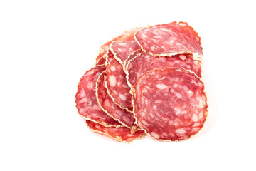 Slices of salami sausage on a white background