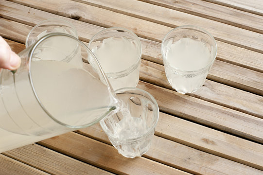 Man pouring refreshing lemonade