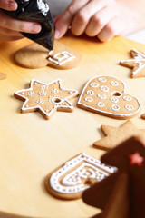 Decorating gingerbread cookies.