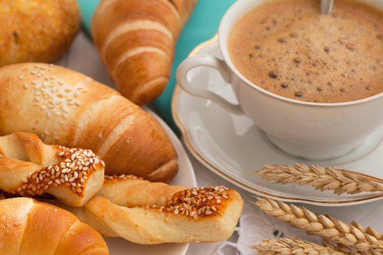 Cup of coffee with pastries 